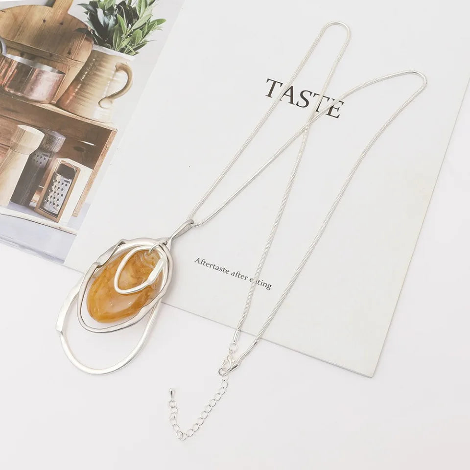 New 2024 European and American light luxury fashion versatile high-end hollow irregular water drop pendant women's long necklace