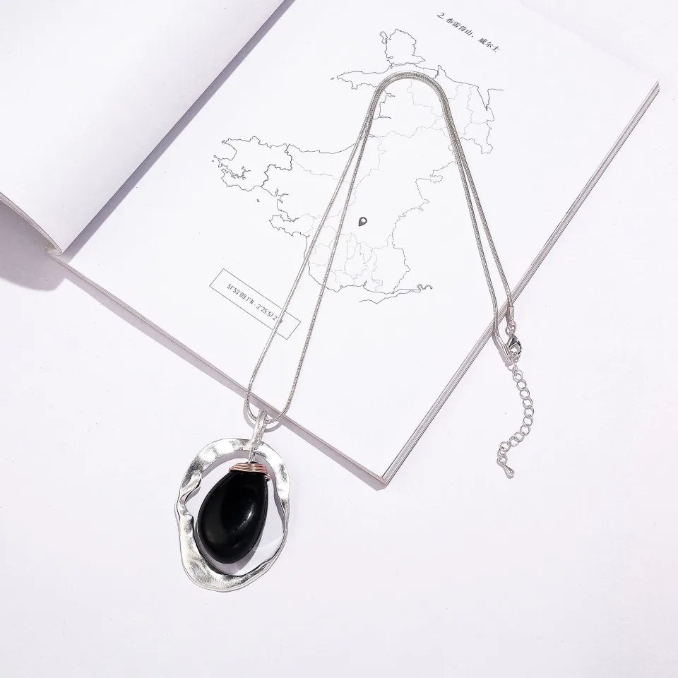 New 2024 European and American light luxury fashion versatile high-end hollow irregular water drop pendant women's long necklace