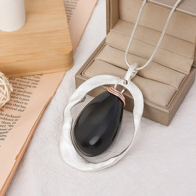 New 2024 European and American light luxury fashion versatile high-end hollow irregular water drop pendant women's long necklace